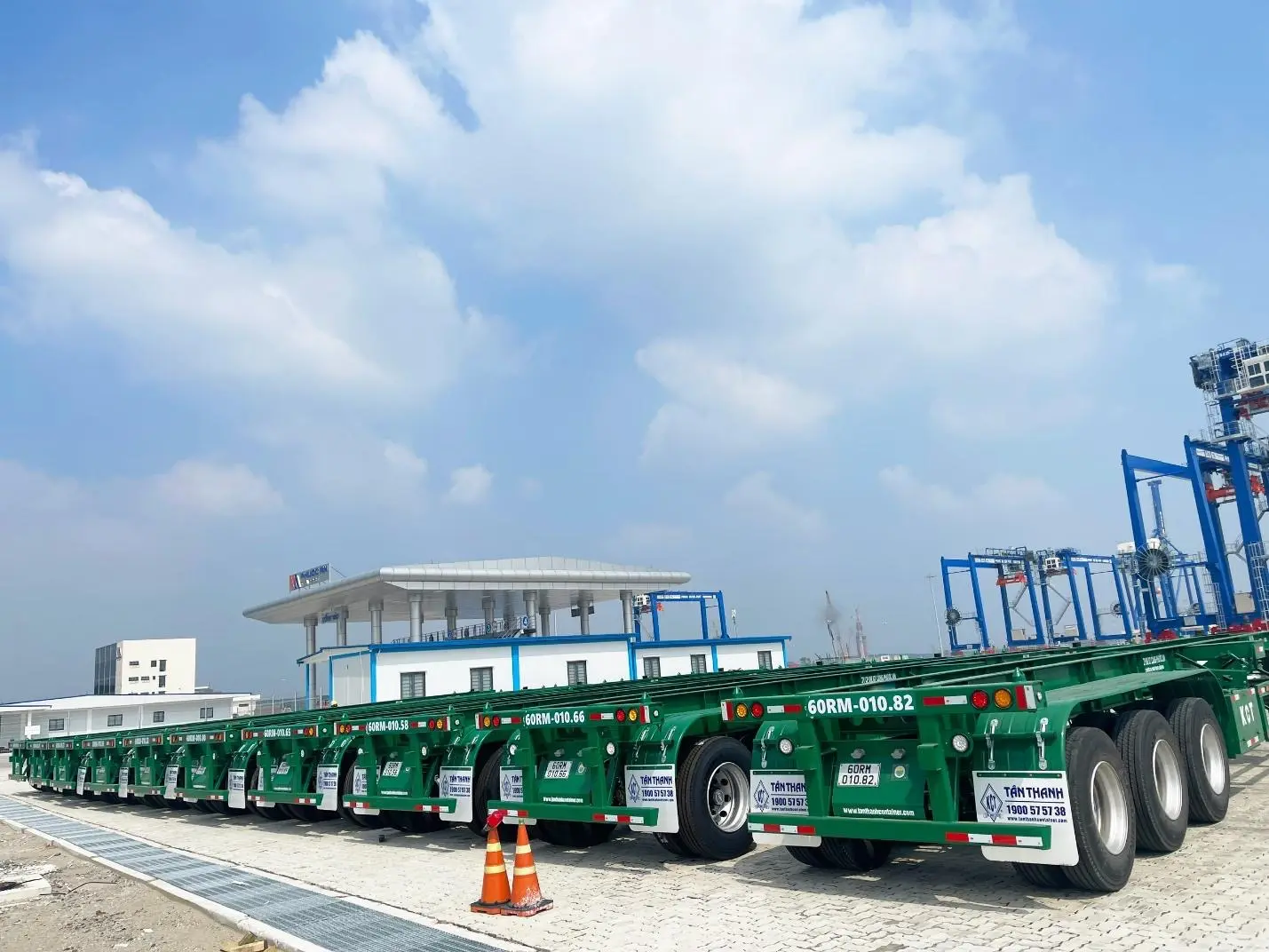 A row of green trailers  AI-generated content may be incorrect.